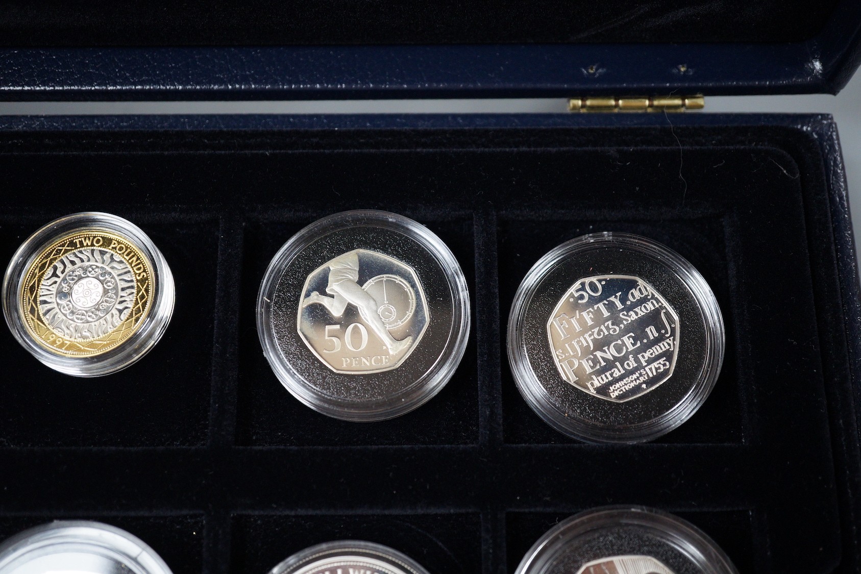 A group of Royal Mint UK commemorative silver proof coins, including 1996 Northern Ireland £1, 1983 royal arms £1, 1995 Welsh £1, 2005 Dictionary 250th anniversary coin, four minute mile 50p, 1997 £2, 50th anniversary D